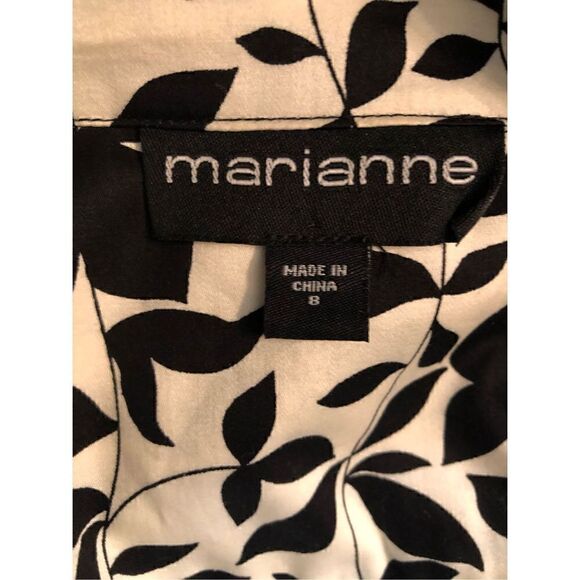 Marianne black and white floral button front with green satin buttoned and trim - Picture 15 of 16